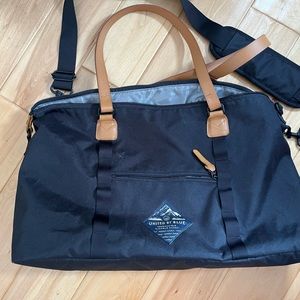 Used once United by Blue duffle, black with tan leather patch